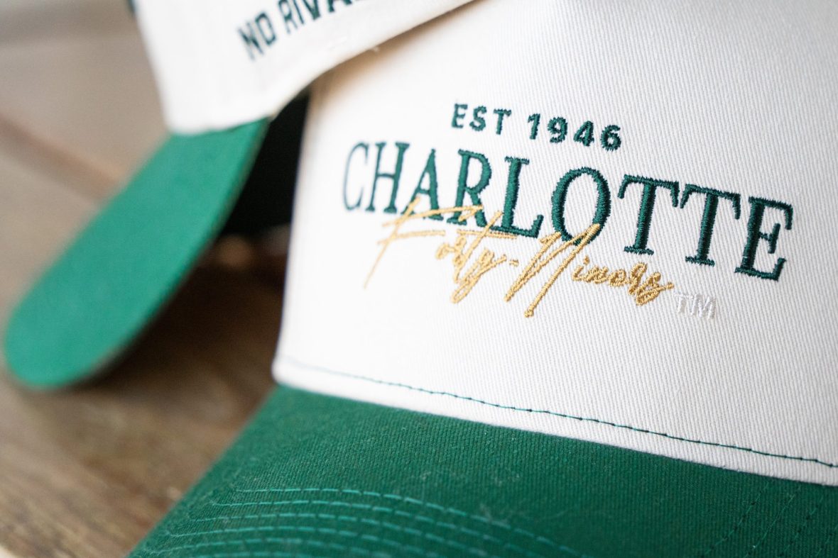 close-up of charlotte-branded hats