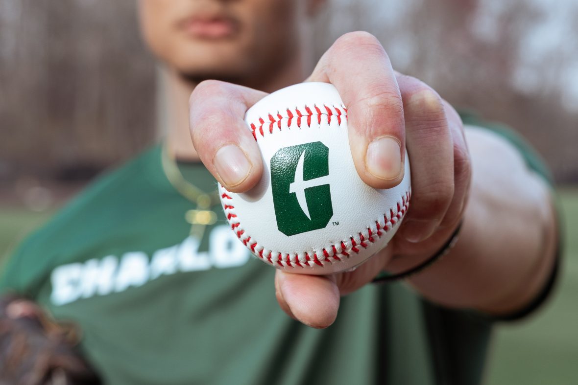 hand holding out baseball with All-in-C logo